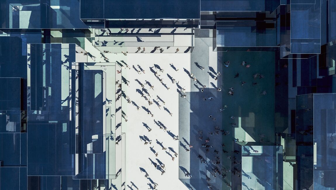 Aerial view of courtyard where people are walking around