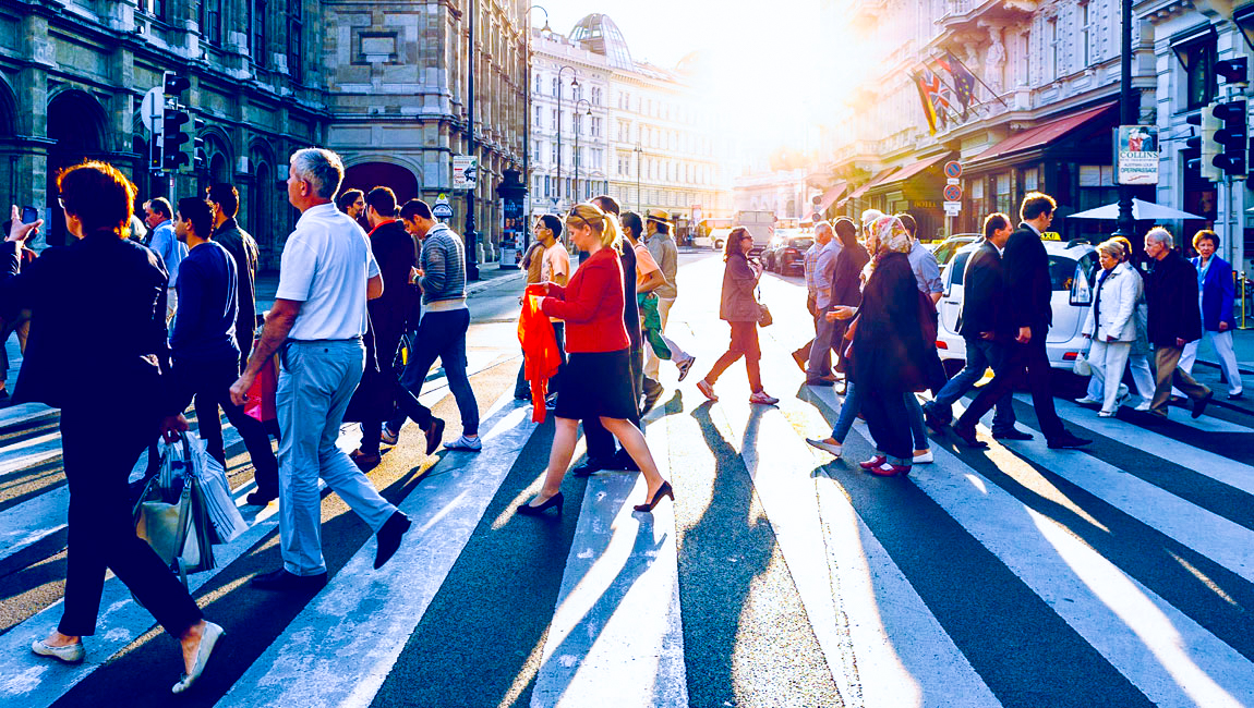 People crossing the street in busy city