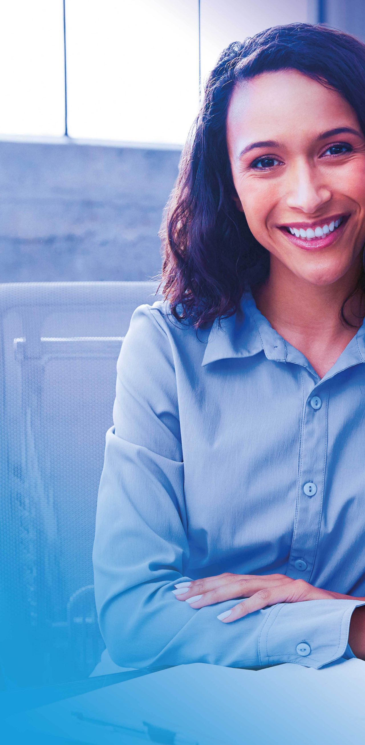 Business woman smiling at her desk