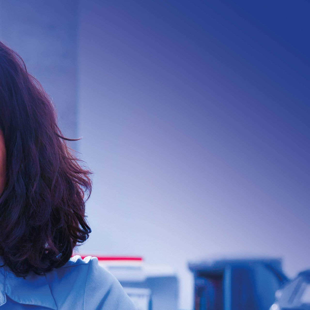 Continuation of business woman smiling at her desk