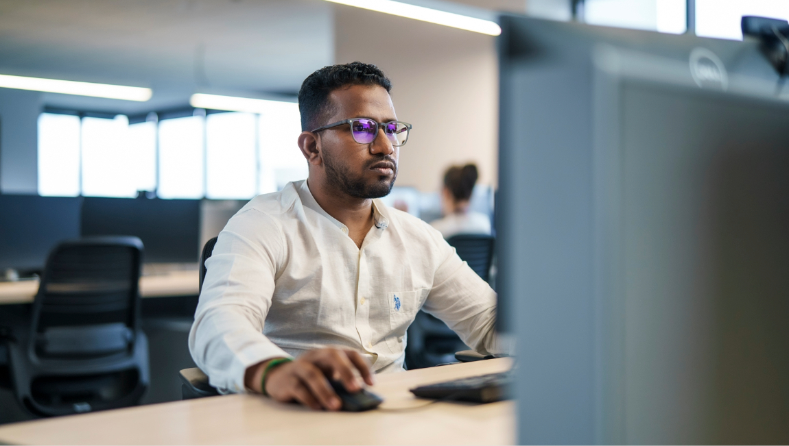 Businessman staring intently at computer screen