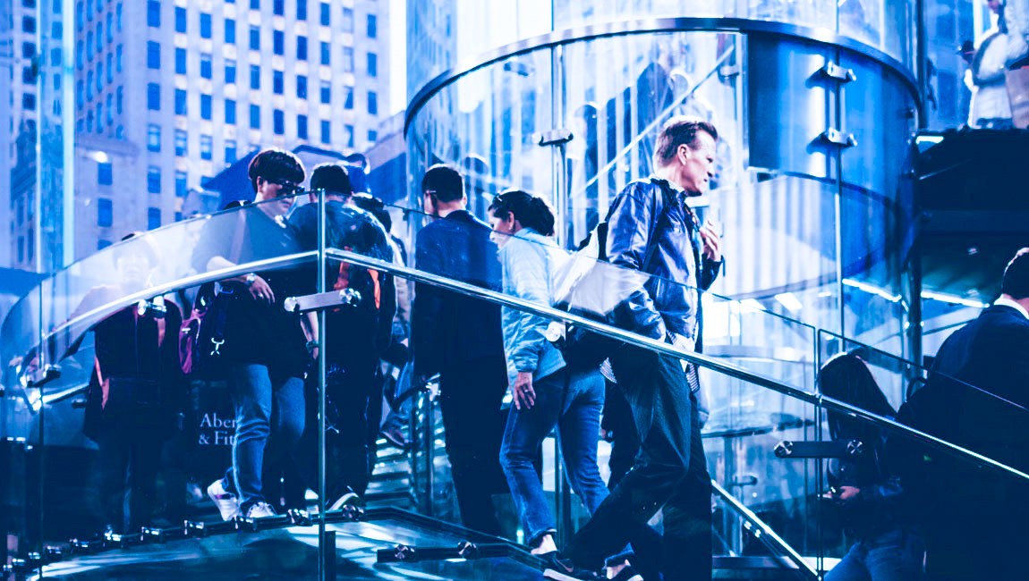 Outdoor city view of business people walking on spiral staircase