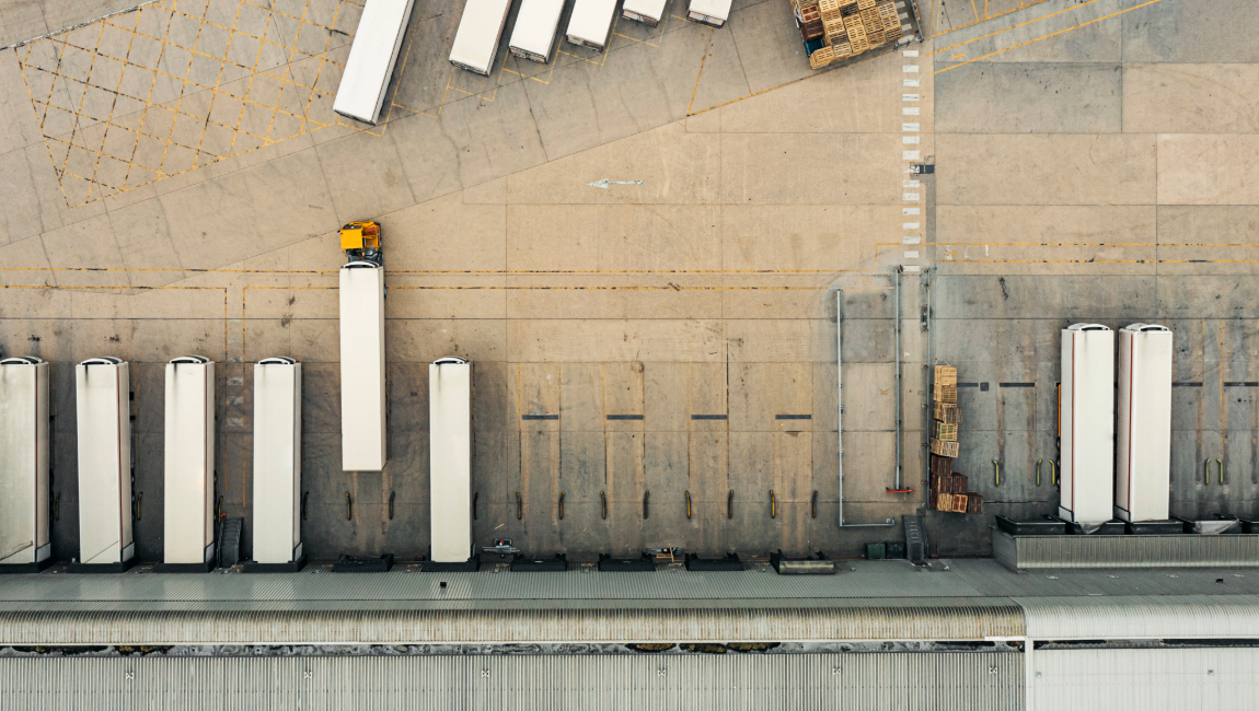 Overhead view of freight cars parked at warehouse