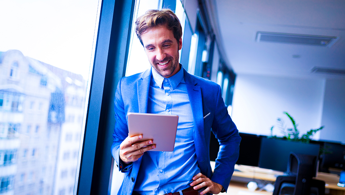 Smiling businessman reviewing notes