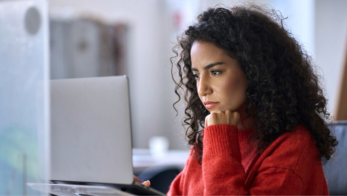 Woman studying a data screen