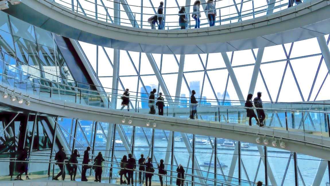 London city hall busy with people walking up and down staircase
